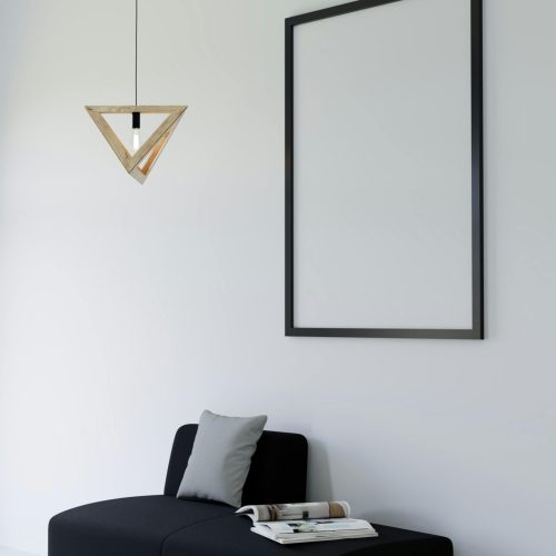 Stylish contemporary living room with black couch and geometric pendant light.