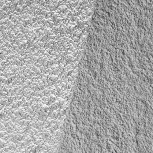Abstract monochrome view of beach sand and ocean textures at Costa Azul, Argentina.